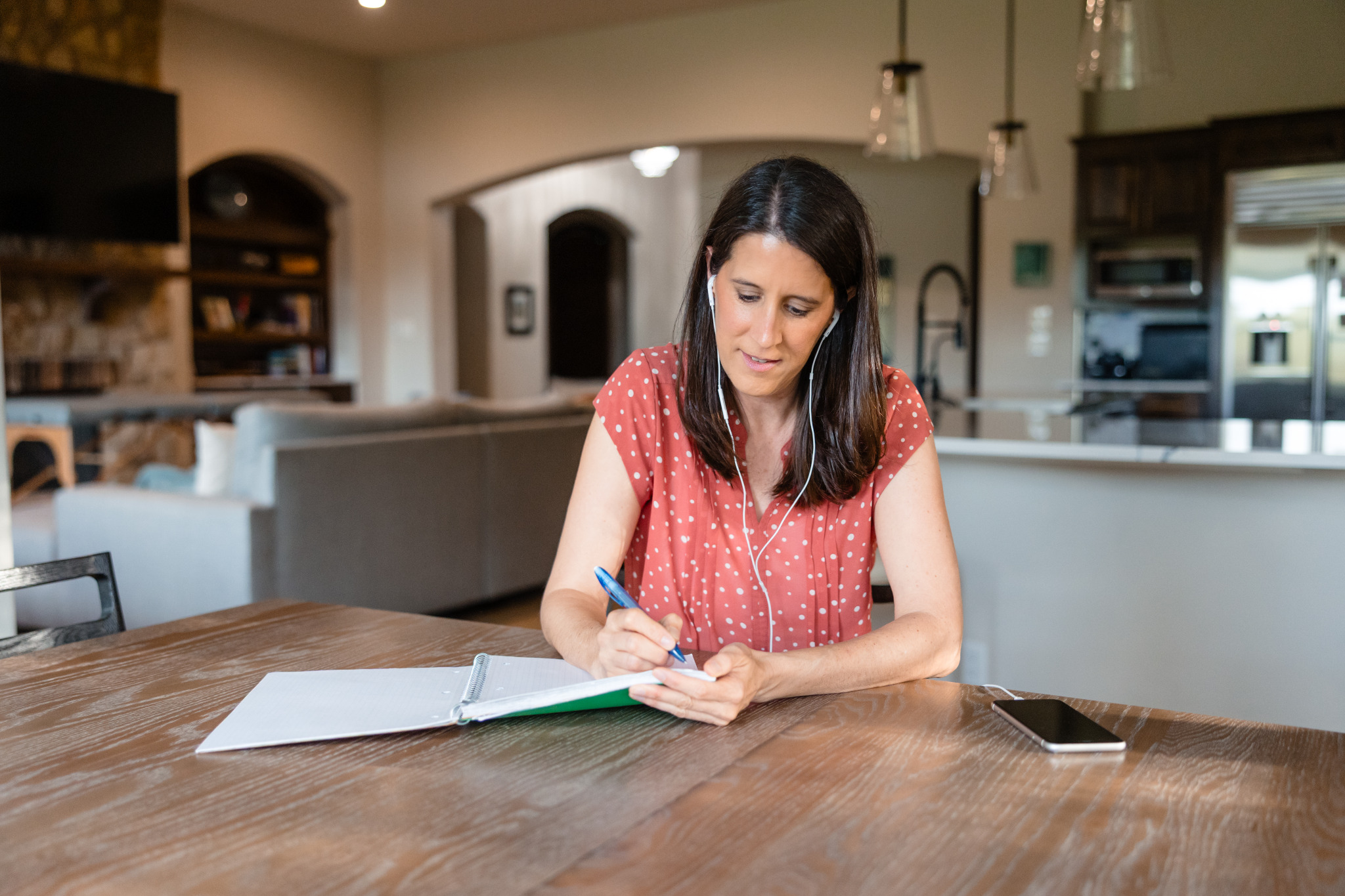 Katie listening and taking notes during a virtual healing session.