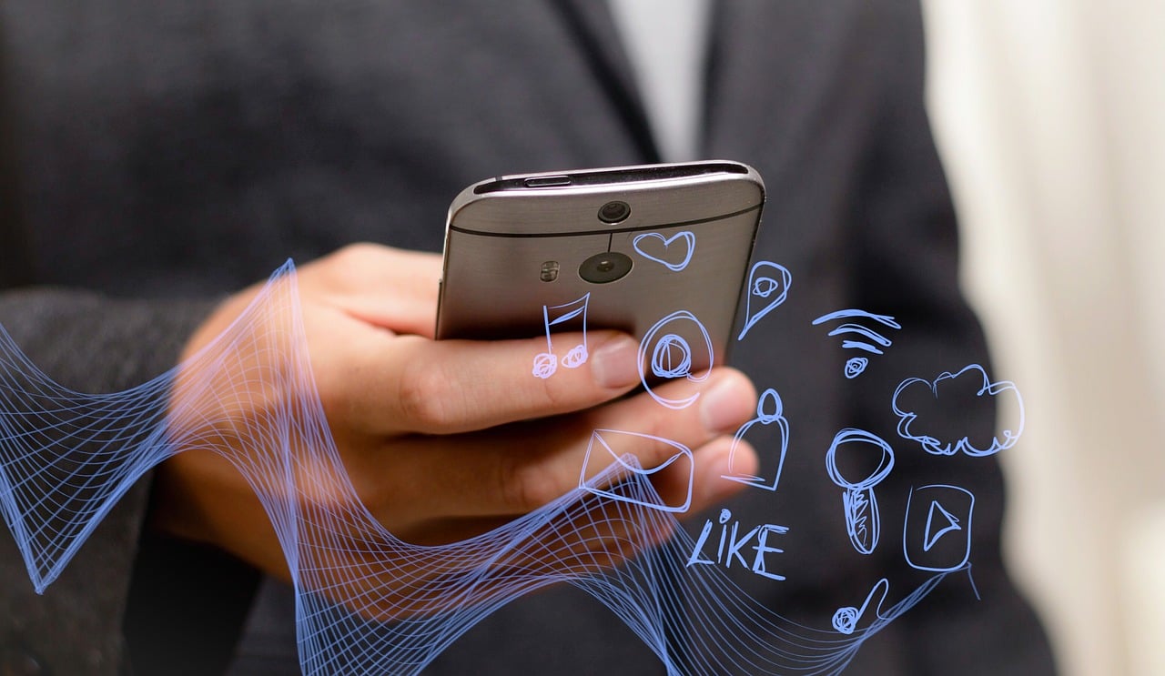 Phone with digital communication graphics.